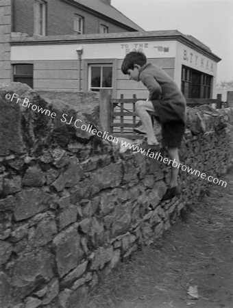 BAR NEAR HARBOUR WITH BOY